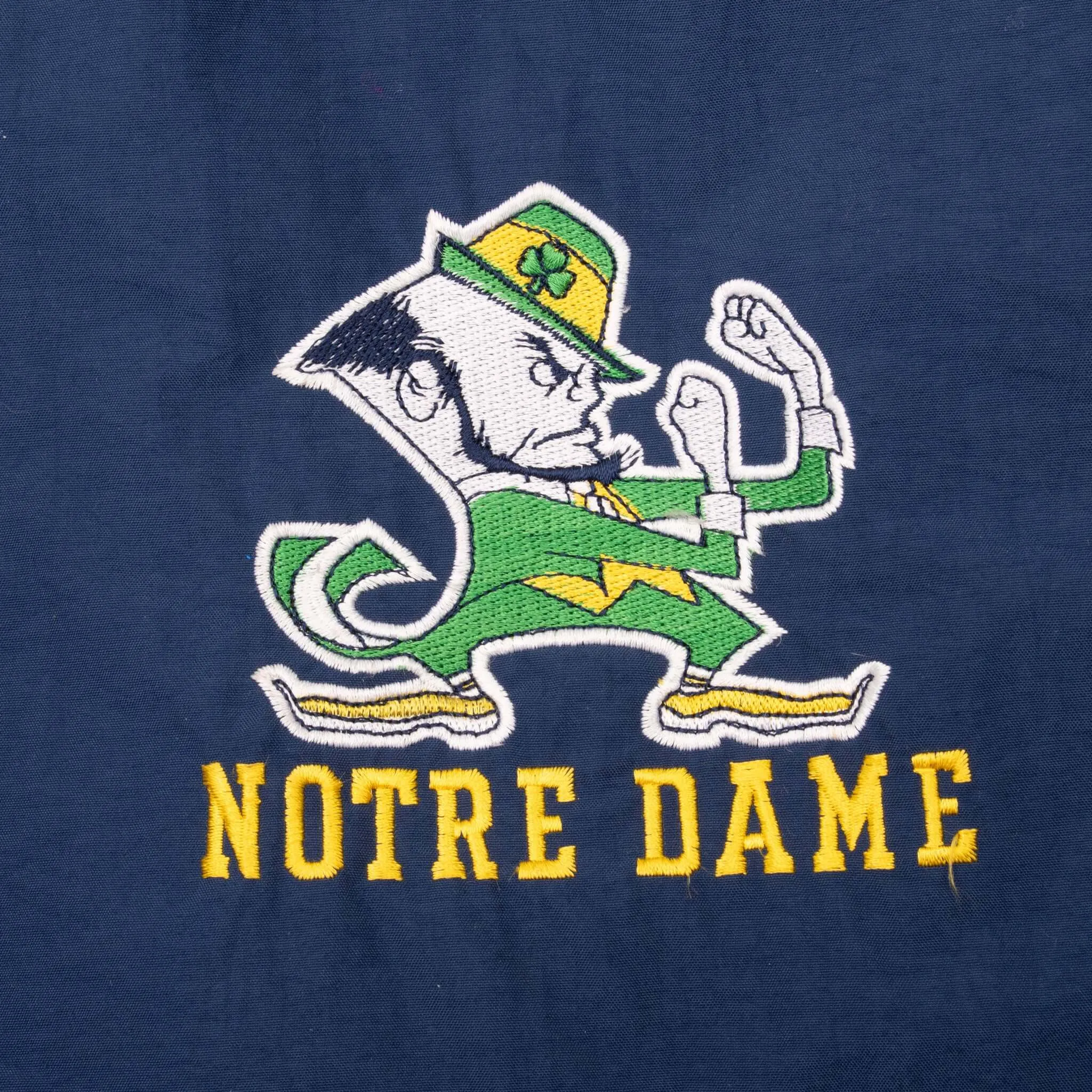 VINTAGE NCAA NOTRE DAME FIGHTING IRISH STARTER WINDBREAKER JACKET 1990S XL